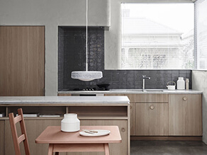 Essential_kitchen_dark_grey_textured_splashback_painted_concrete_wall_marble_countertop_timber 